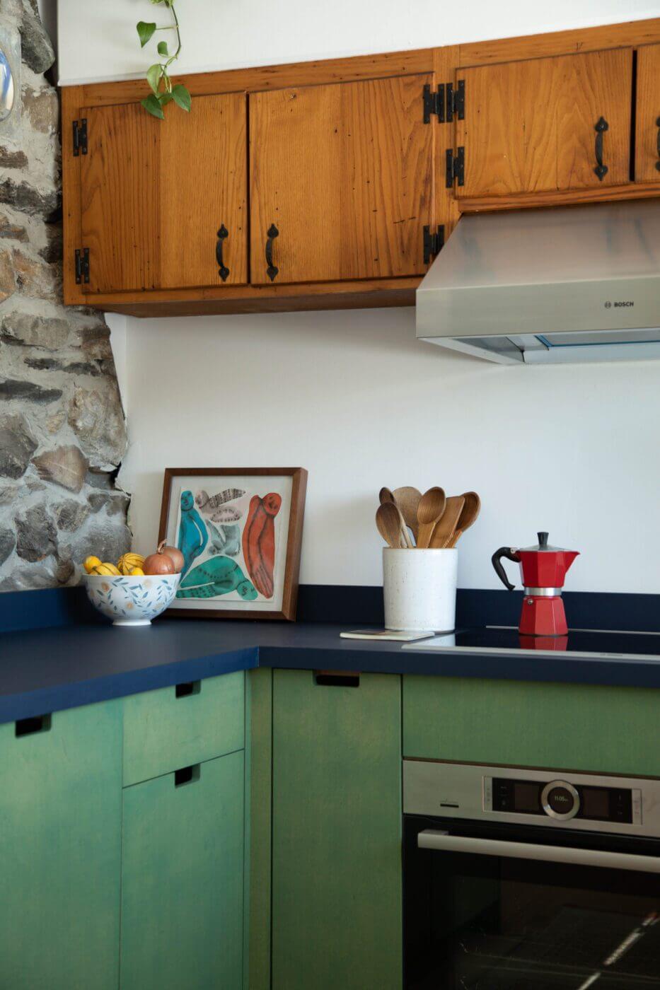 Lower cabinets are made from plywood finished with Osmo wood wax. Countertops are blue FENIX laminate.